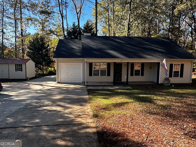 ranch-style house featuring a garage, a storage shed, and a front lawn