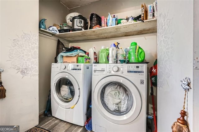 laundry room featuring hardwood / wood-style flooring and washing machine and clothes dryer