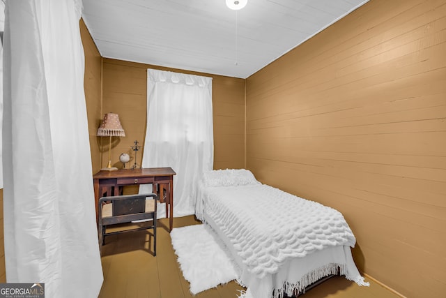 bedroom with wooden walls