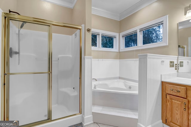 bathroom with vanity, ornamental molding, and shower with separate bathtub