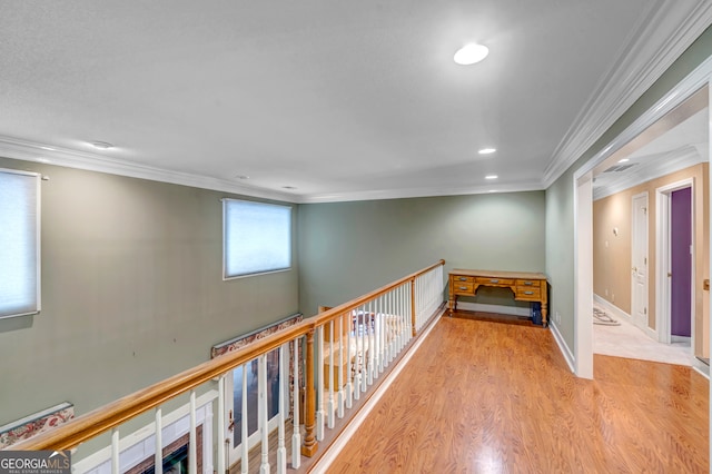 hallway with crown molding and light wood-type flooring