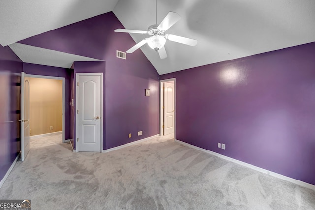 unfurnished bedroom with light carpet, high vaulted ceiling, and ceiling fan