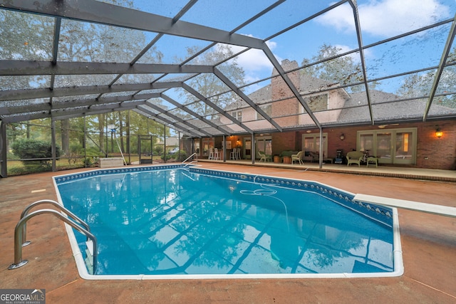 view of pool with a lanai and a patio area