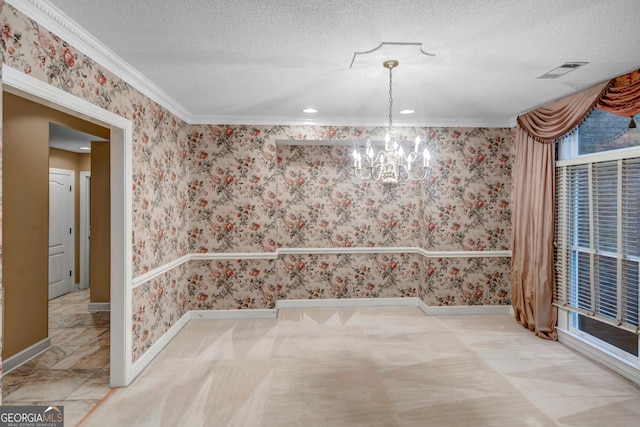 unfurnished dining area with crown molding, a textured ceiling, and an inviting chandelier