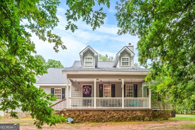 cape cod-style house with a porch