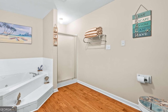 bathroom with wood-type flooring and plus walk in shower