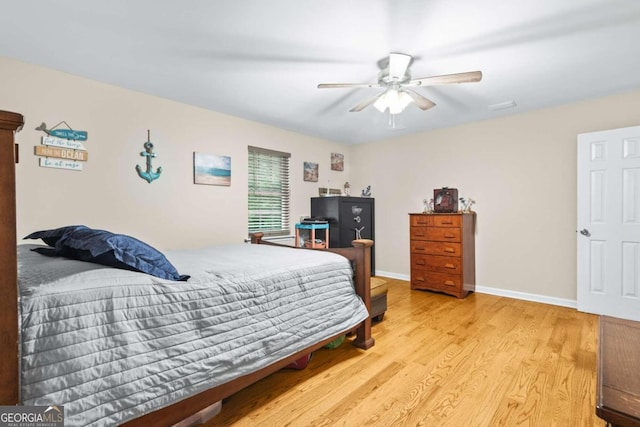 bedroom featuring ceiling fan and light wood-type flooring