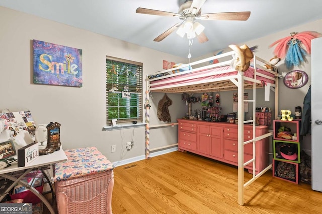 bedroom with hardwood / wood-style flooring and ceiling fan