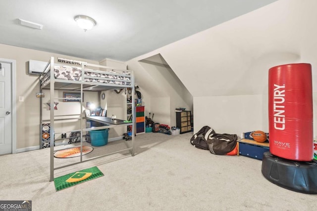 interior space featuring lofted ceiling, carpet floors, and a wall mounted air conditioner