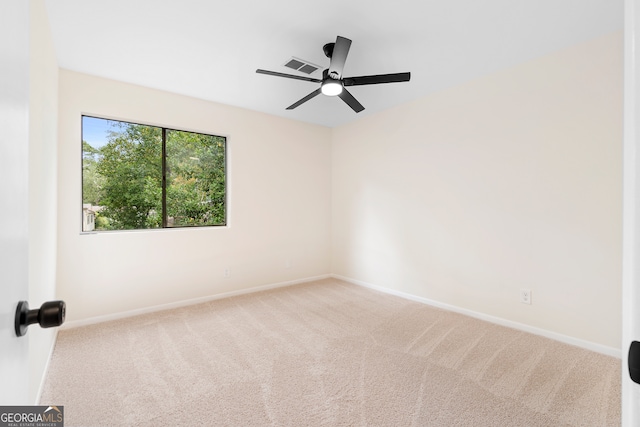 unfurnished room with ceiling fan and carpet floors