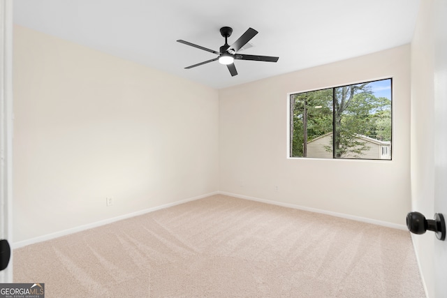 carpeted empty room with ceiling fan