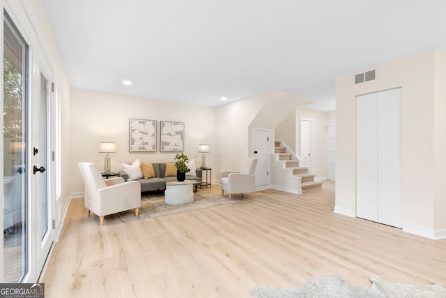 living room with light hardwood / wood-style flooring