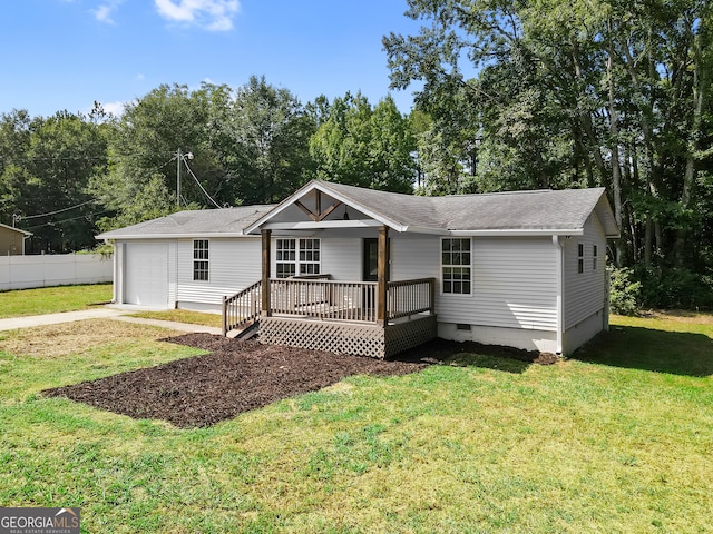 ranch-style house featuring a garage and a front yard