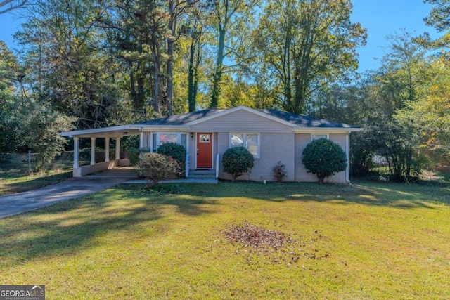 ranch-style home with a front yard and a carport