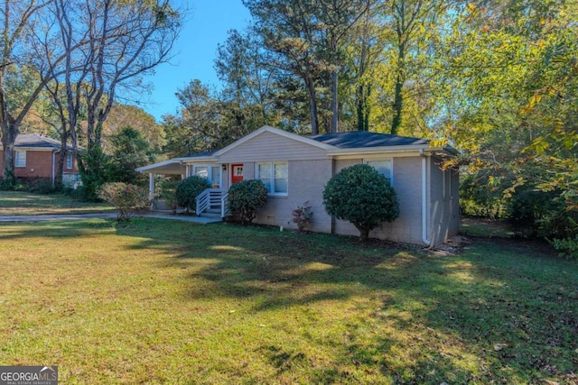 ranch-style house with a front lawn