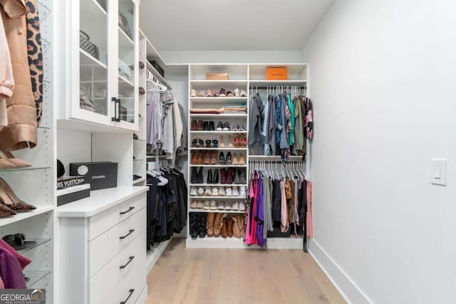 spacious closet featuring light wood-type flooring