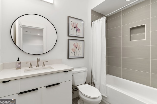 full bathroom featuring shower / bath combination with curtain, vanity, and toilet