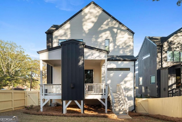 back of property with covered porch