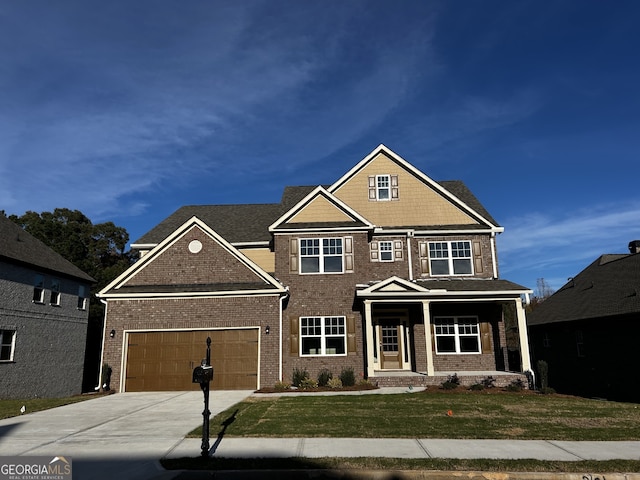 view of front facade with a garage and a front lawn