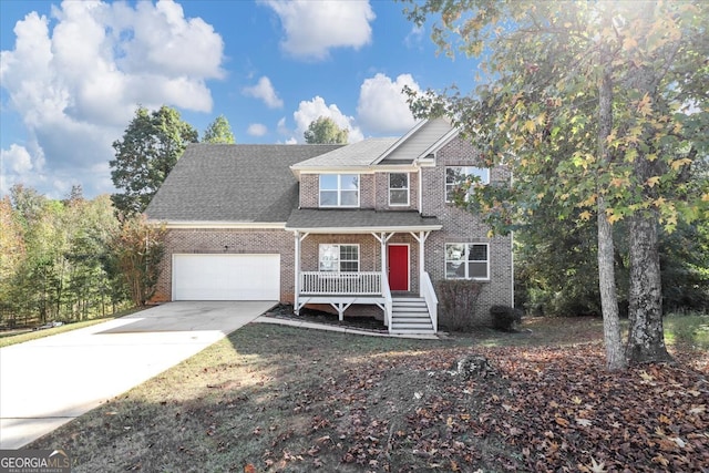 view of front of house featuring a porch and a garage