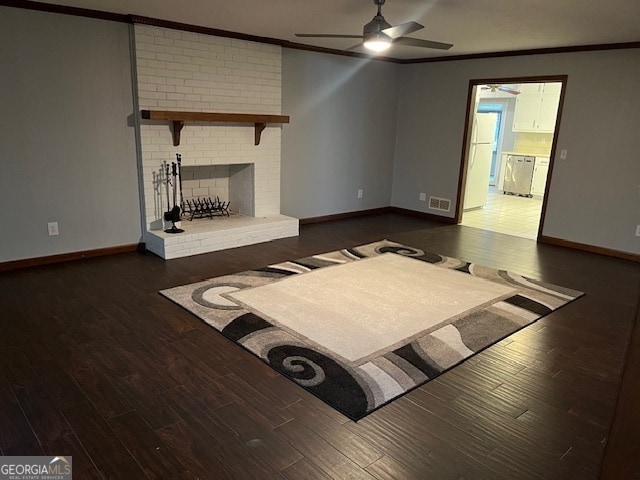 unfurnished living room with a fireplace, ceiling fan, dark hardwood / wood-style flooring, and crown molding