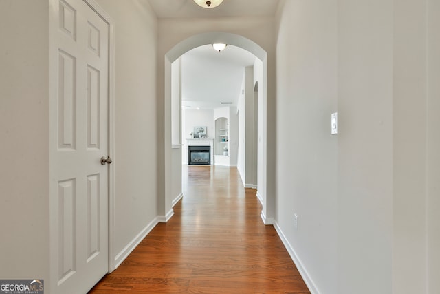 hall with wood-type flooring