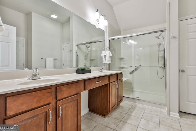 bathroom featuring tile patterned floors, lofted ceiling, vanity, and an enclosed shower