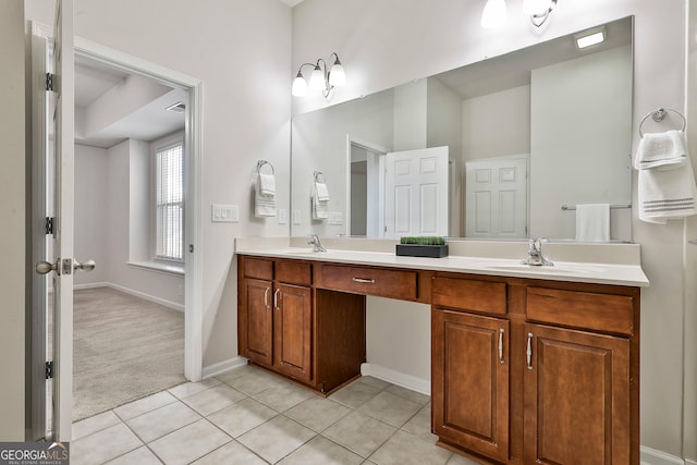 bathroom with tile patterned flooring and vanity