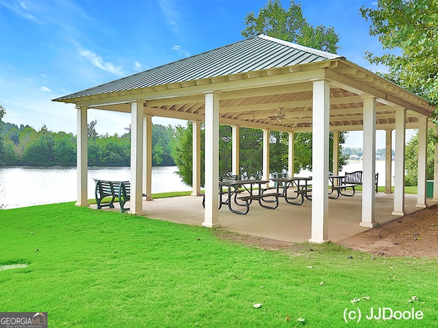 view of home's community featuring a gazebo, a lawn, and a water view