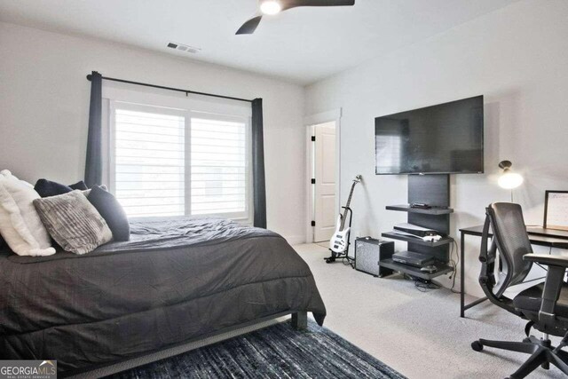 carpeted bedroom featuring ceiling fan