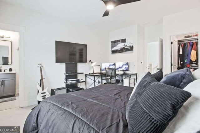 carpeted bedroom featuring ceiling fan and a closet