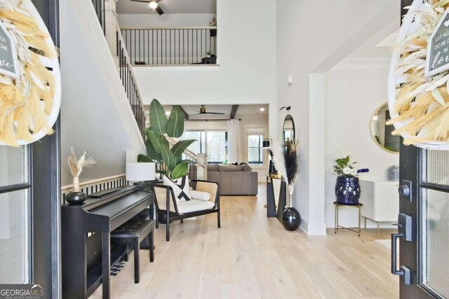 entrance foyer featuring ceiling fan and light hardwood / wood-style floors