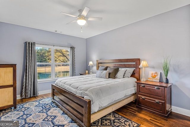 bedroom featuring dark hardwood / wood-style floors and ceiling fan