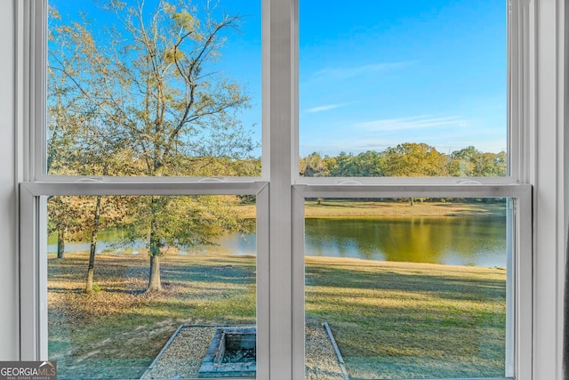 doorway featuring plenty of natural light and a water view