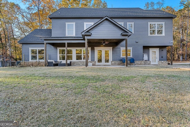 rear view of property with an outdoor hangout area, ceiling fan, a yard, and french doors