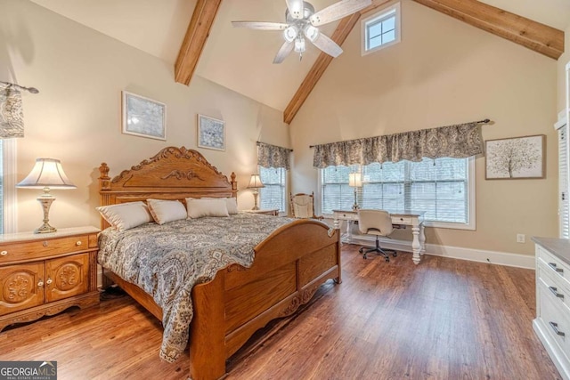 bedroom featuring hardwood / wood-style floors, ceiling fan, beamed ceiling, and high vaulted ceiling