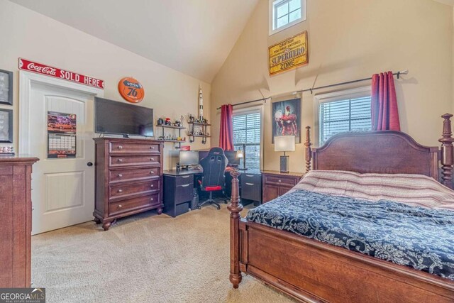 bedroom with high vaulted ceiling and light colored carpet