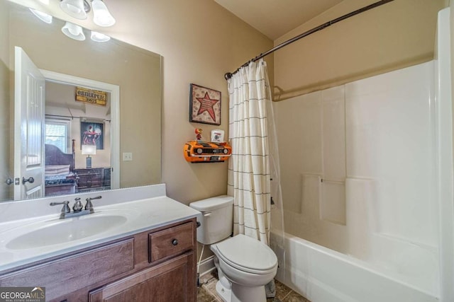 full bathroom featuring shower / bath combo, vanity, and toilet