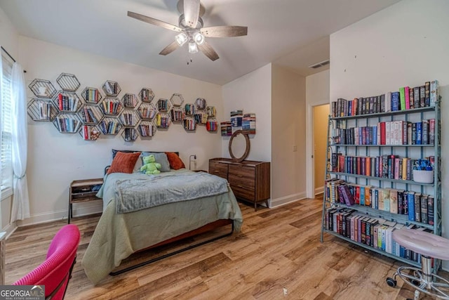 bedroom featuring light wood-type flooring and ceiling fan