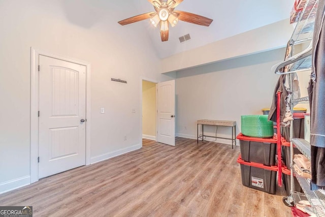 interior space featuring vaulted ceiling, light hardwood / wood-style flooring, and ceiling fan