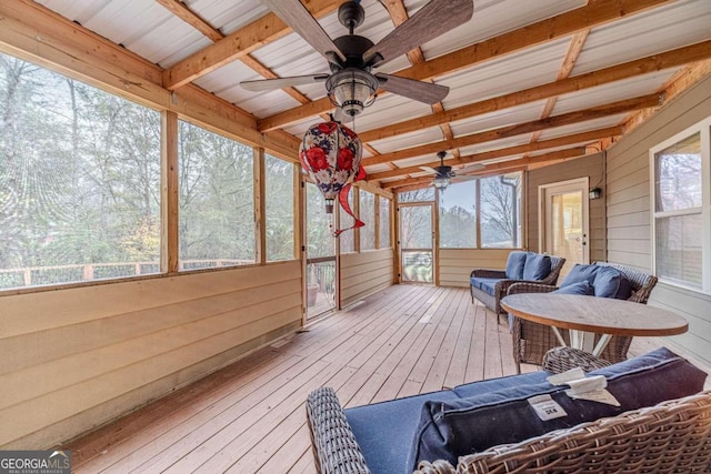 sunroom with vaulted ceiling with beams and ceiling fan