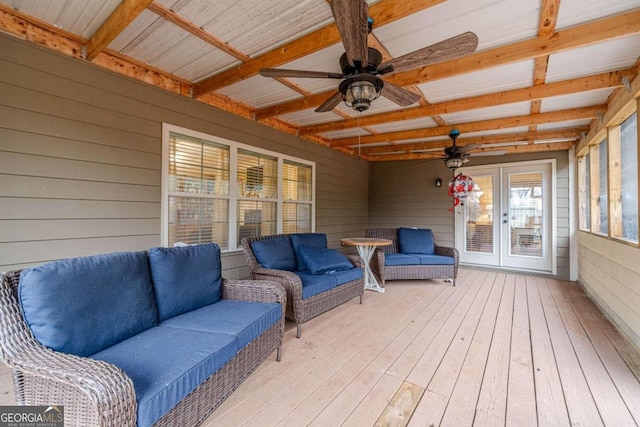 interior space featuring beam ceiling, ceiling fan, and french doors