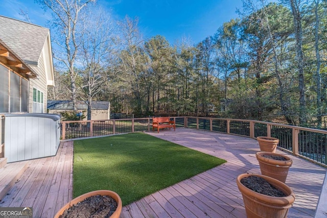 wooden terrace with a lawn