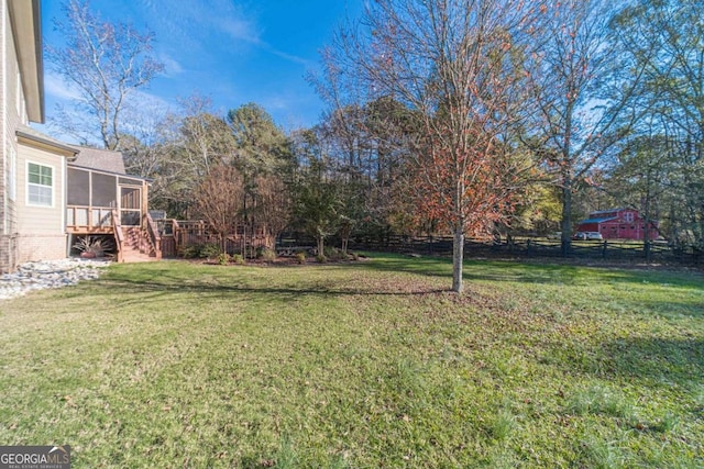 view of yard with a sunroom