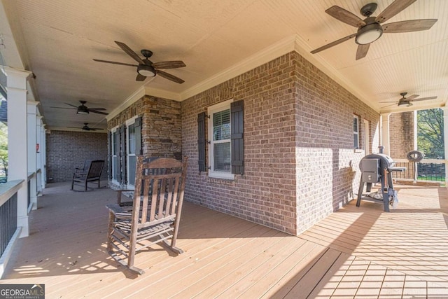 wooden terrace featuring covered porch