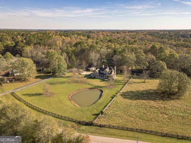 birds eye view of property with a rural view