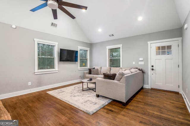 living room with dark hardwood / wood-style flooring, high vaulted ceiling, and ceiling fan