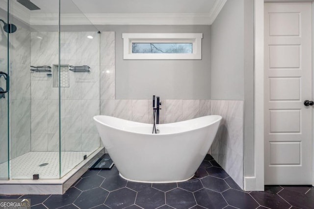 bathroom featuring tile patterned flooring, shower with separate bathtub, tile walls, and ornamental molding