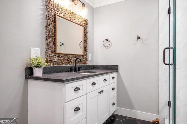 bathroom with tile patterned floors, crown molding, and vanity