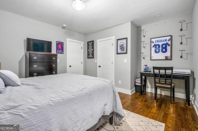 bedroom featuring dark hardwood / wood-style floors